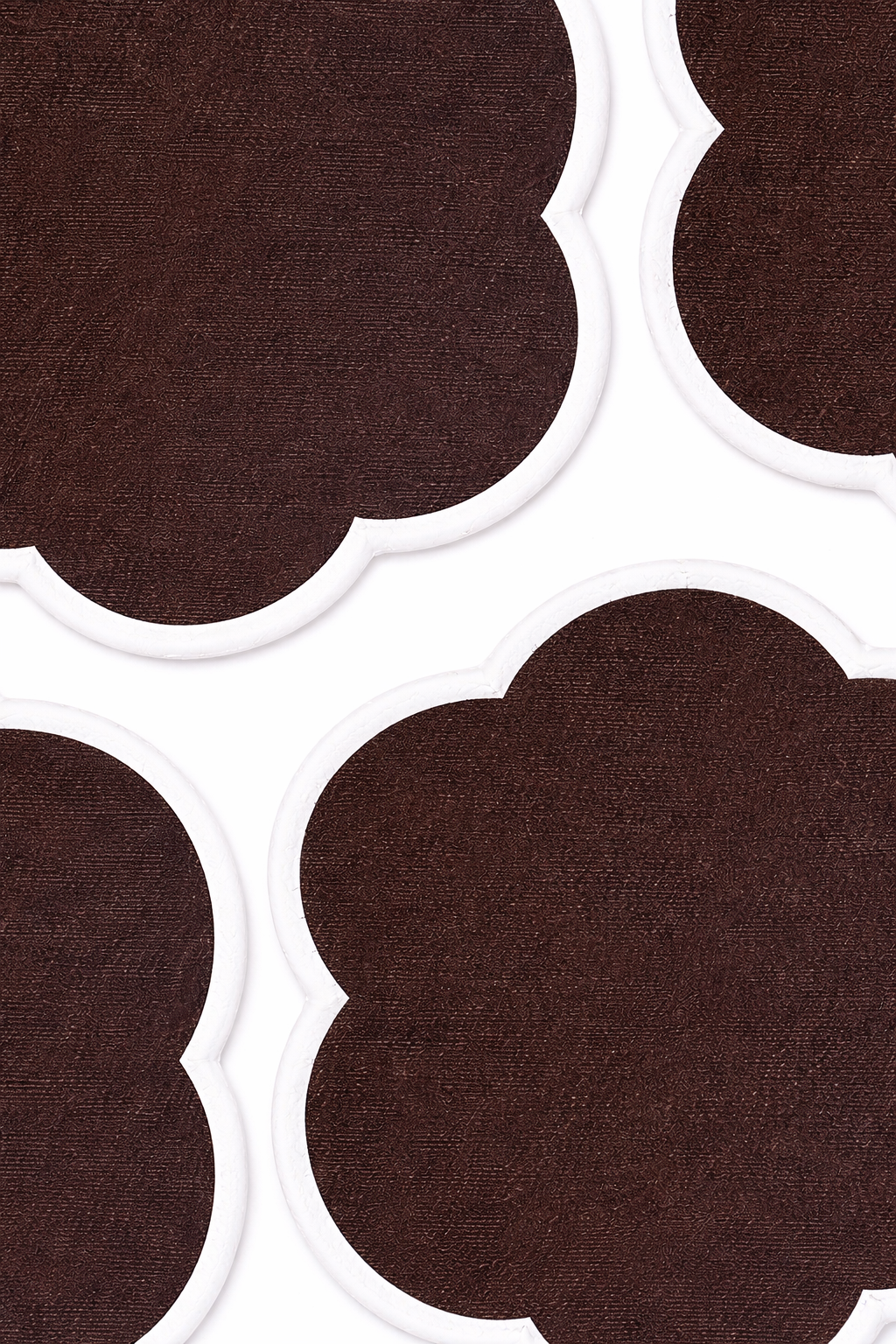 Close up of four cotton chocolate brown coasters front view
