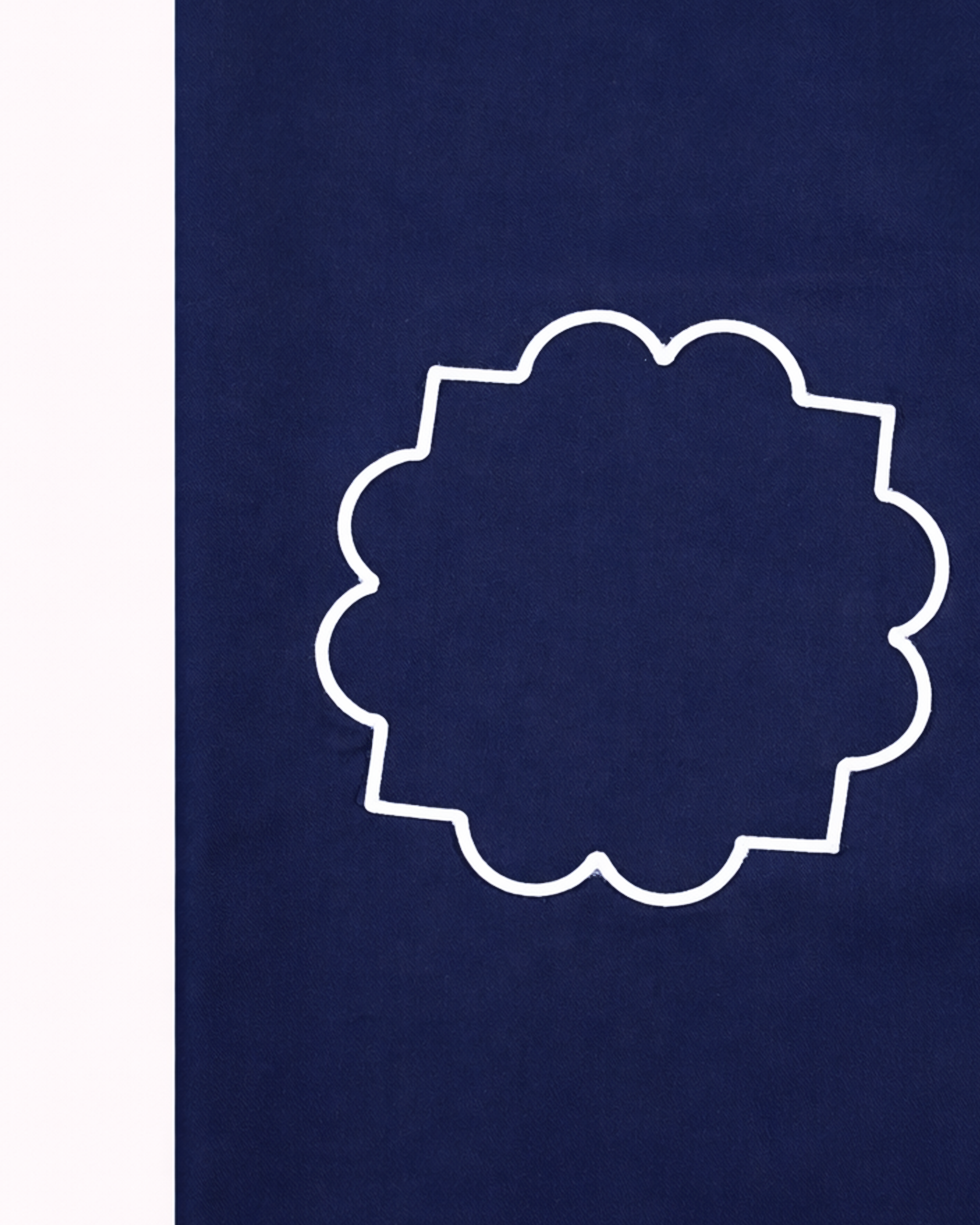 Close up of navy blue apron's pocket with white lining front view