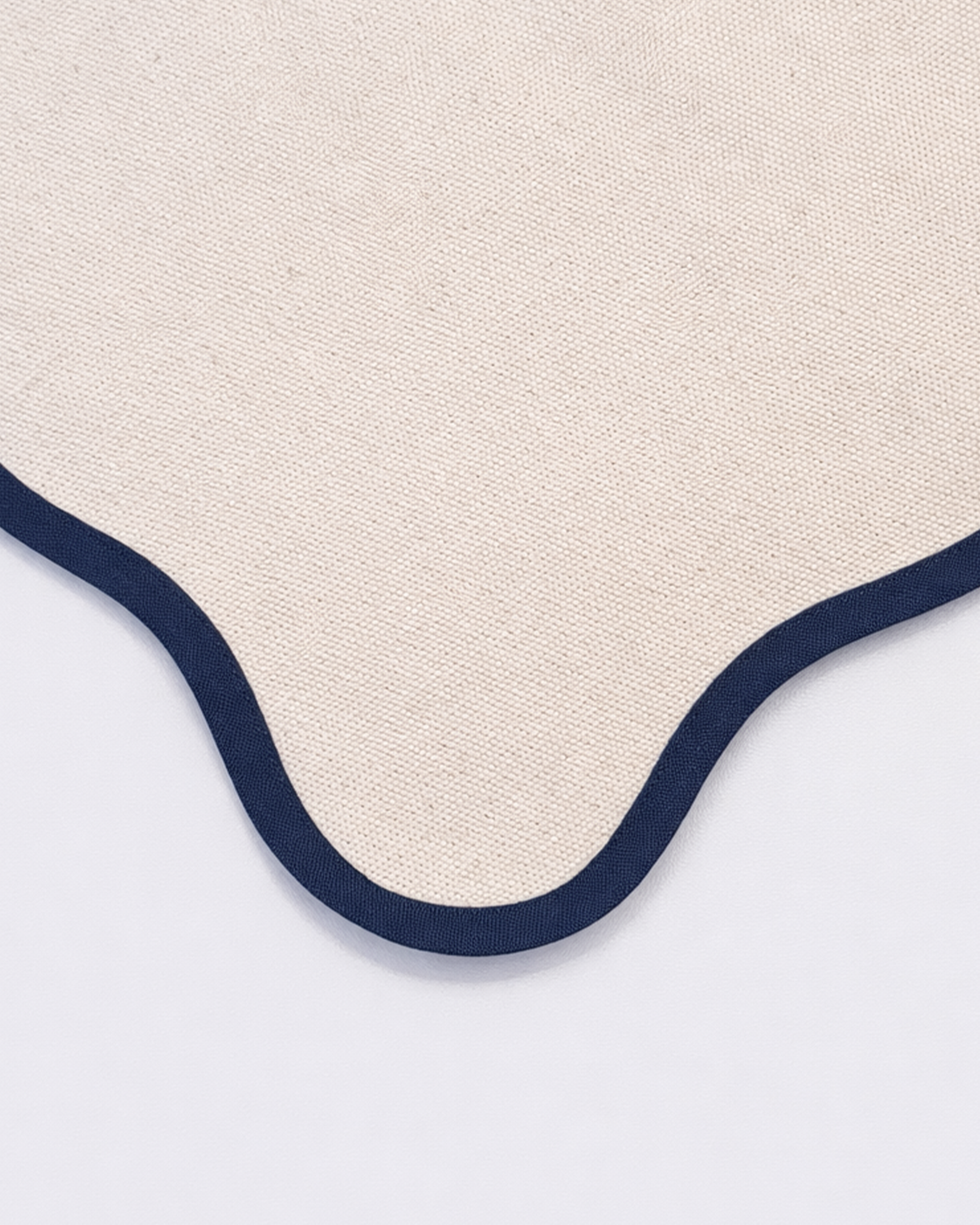 Close up of cotton texture of off-white cotton placemat front view