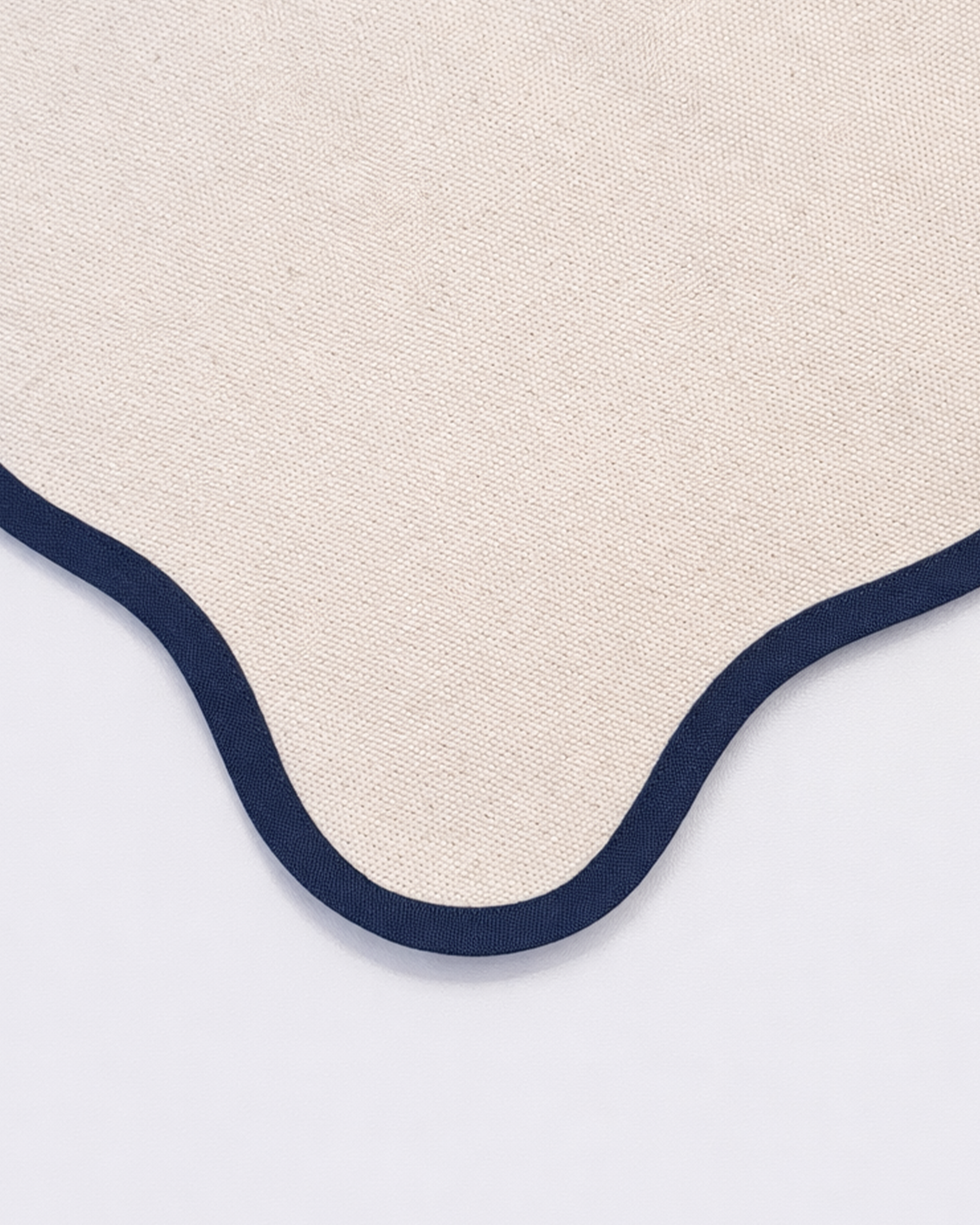 Close up of cotton texture of off-white cotton placemat front view