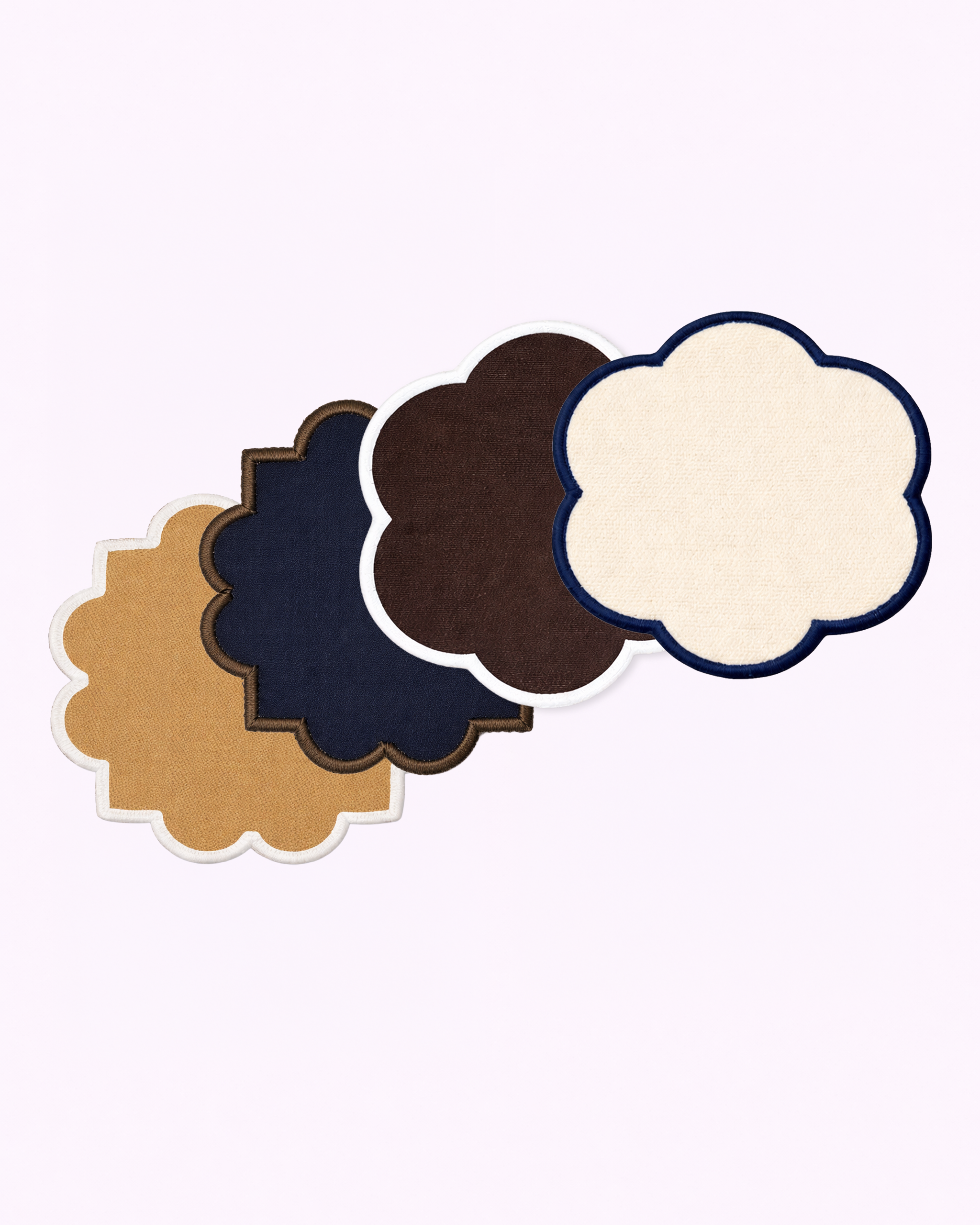 Set of four cotton coasters in camel, navy blue, chocolate brown and off-white front view