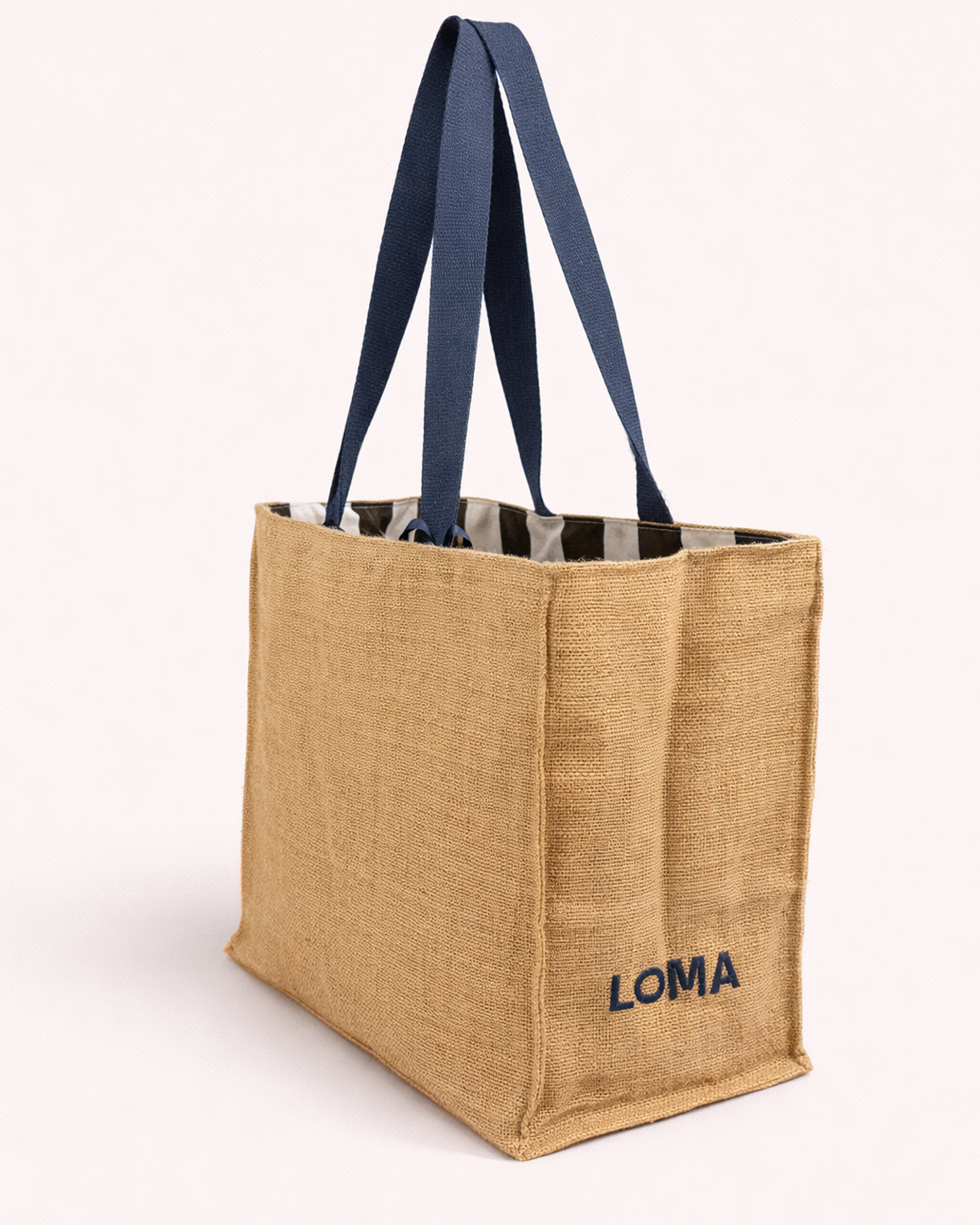 Jute tote bag with striped interior and blue shoulder straps side view