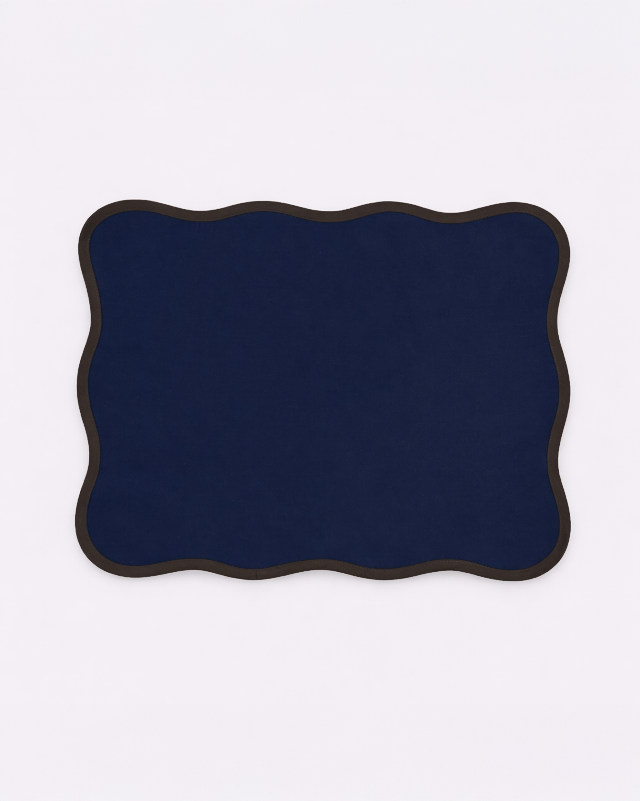 Navy blue cotton placemat with scalloped edge front view