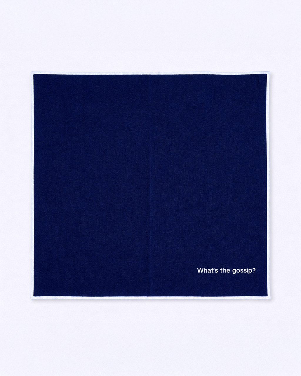 Full size navy blue napkin with embroidered white quote front view