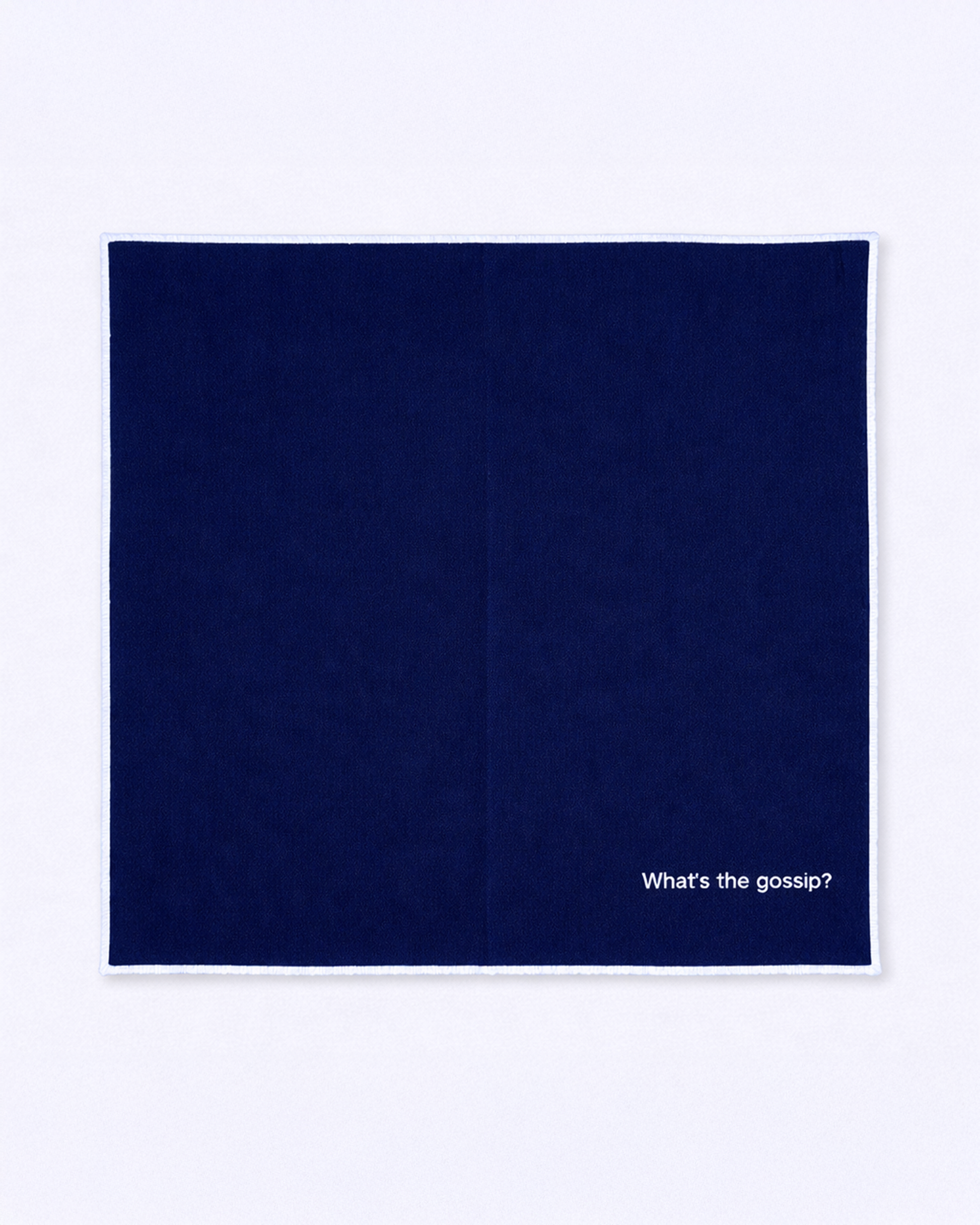 Full size navy blue napkin with embroidered white quote front view