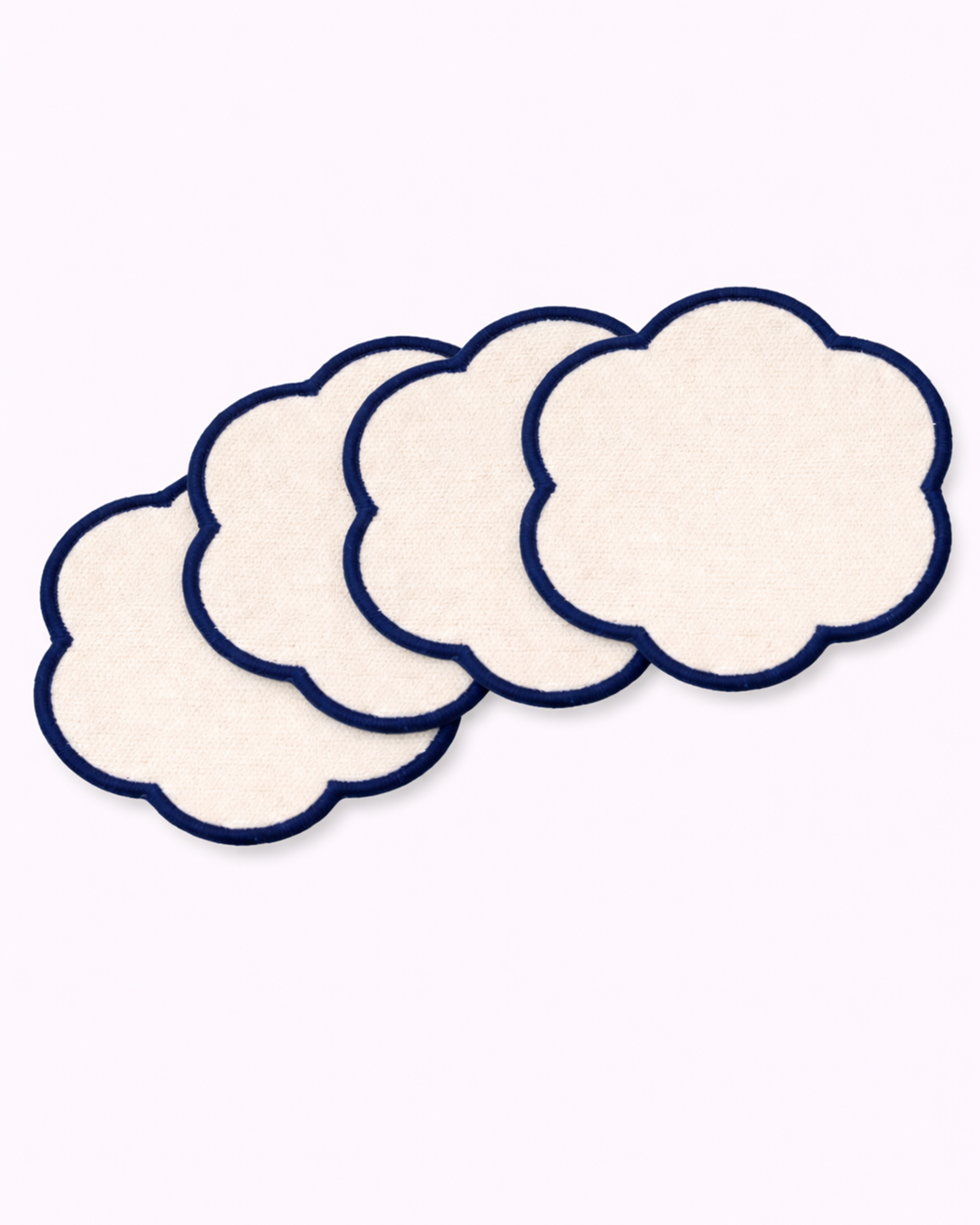 Set of four off-white cotton coasters front view