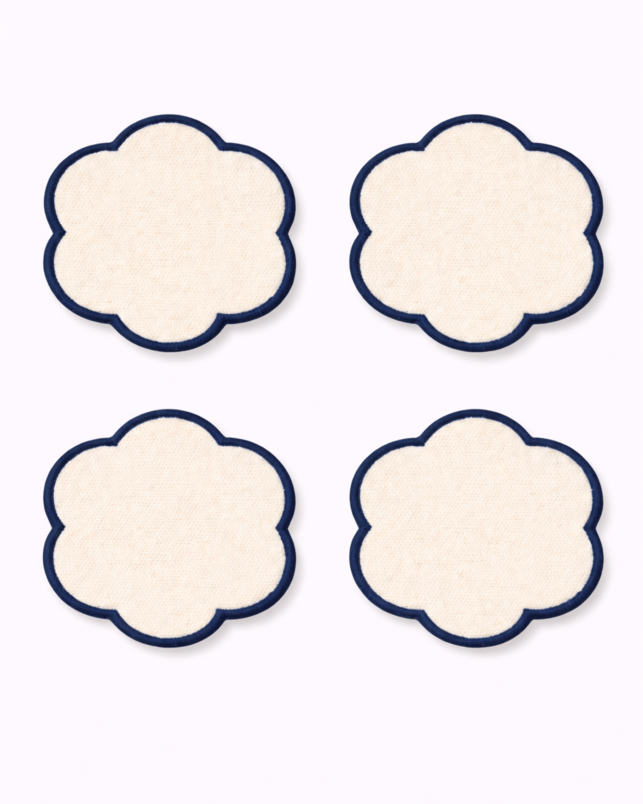Set of four off-white cotton coasters front view