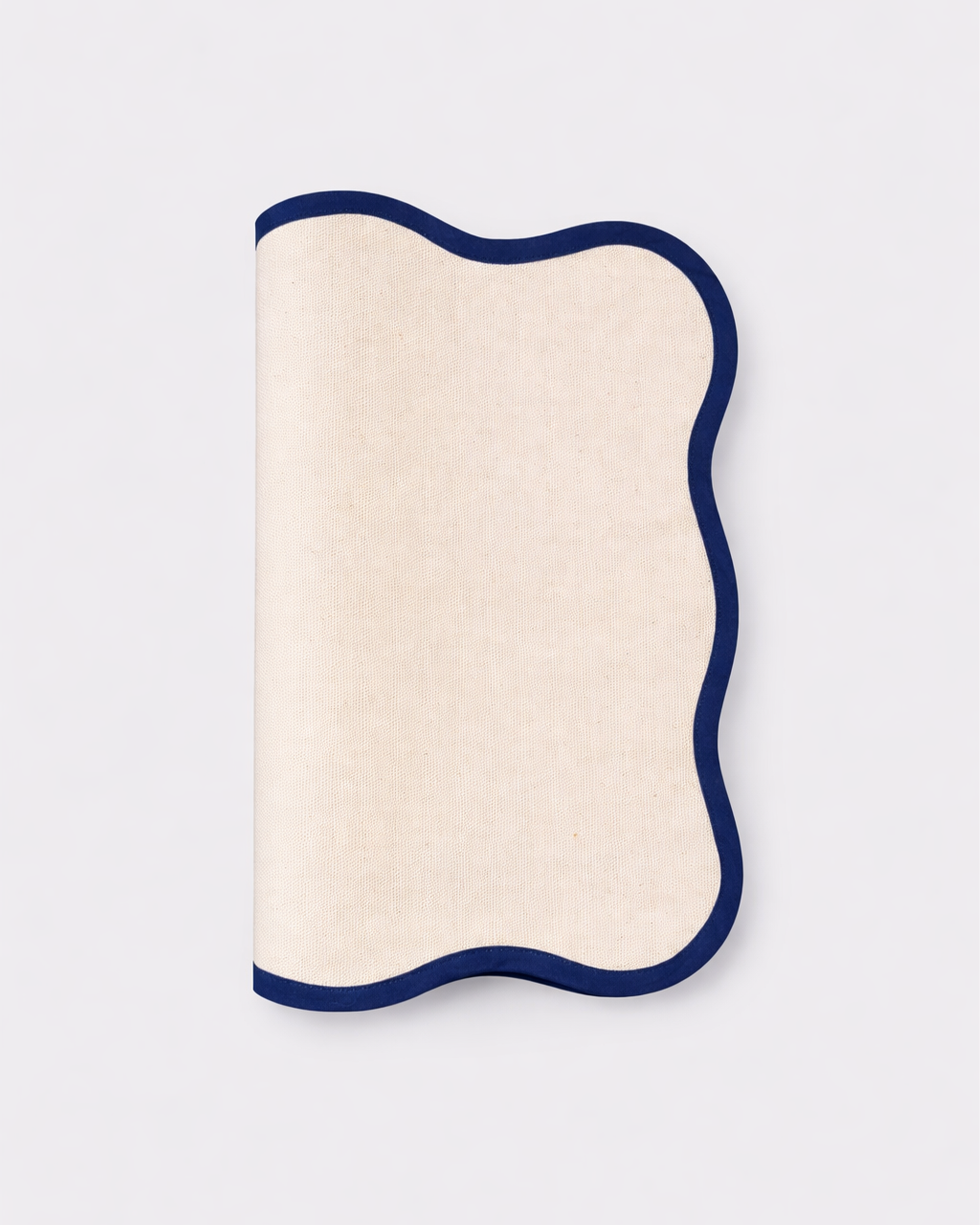 Folded off-white cotton placemat front view