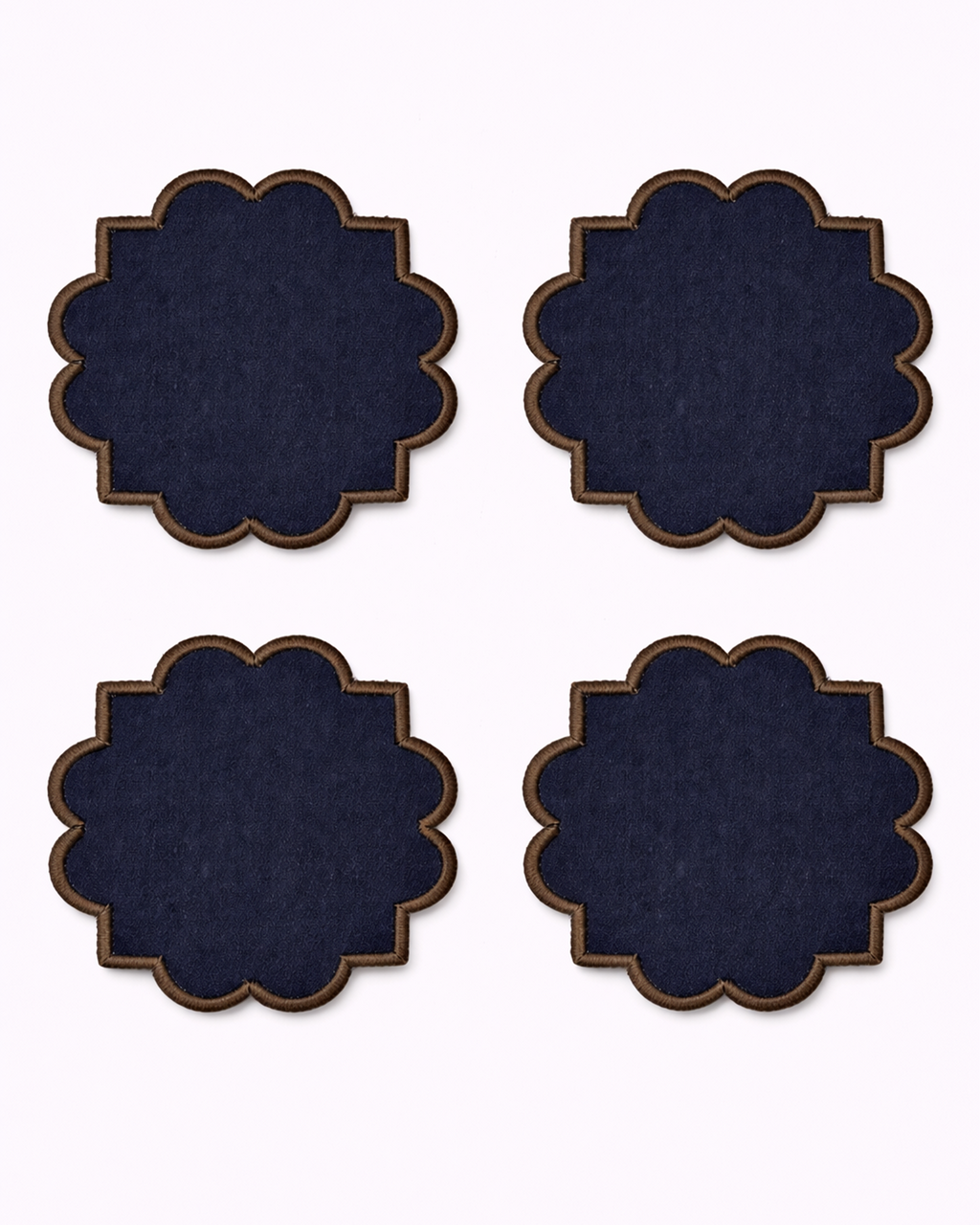 Four navy blue cotton coasters front view