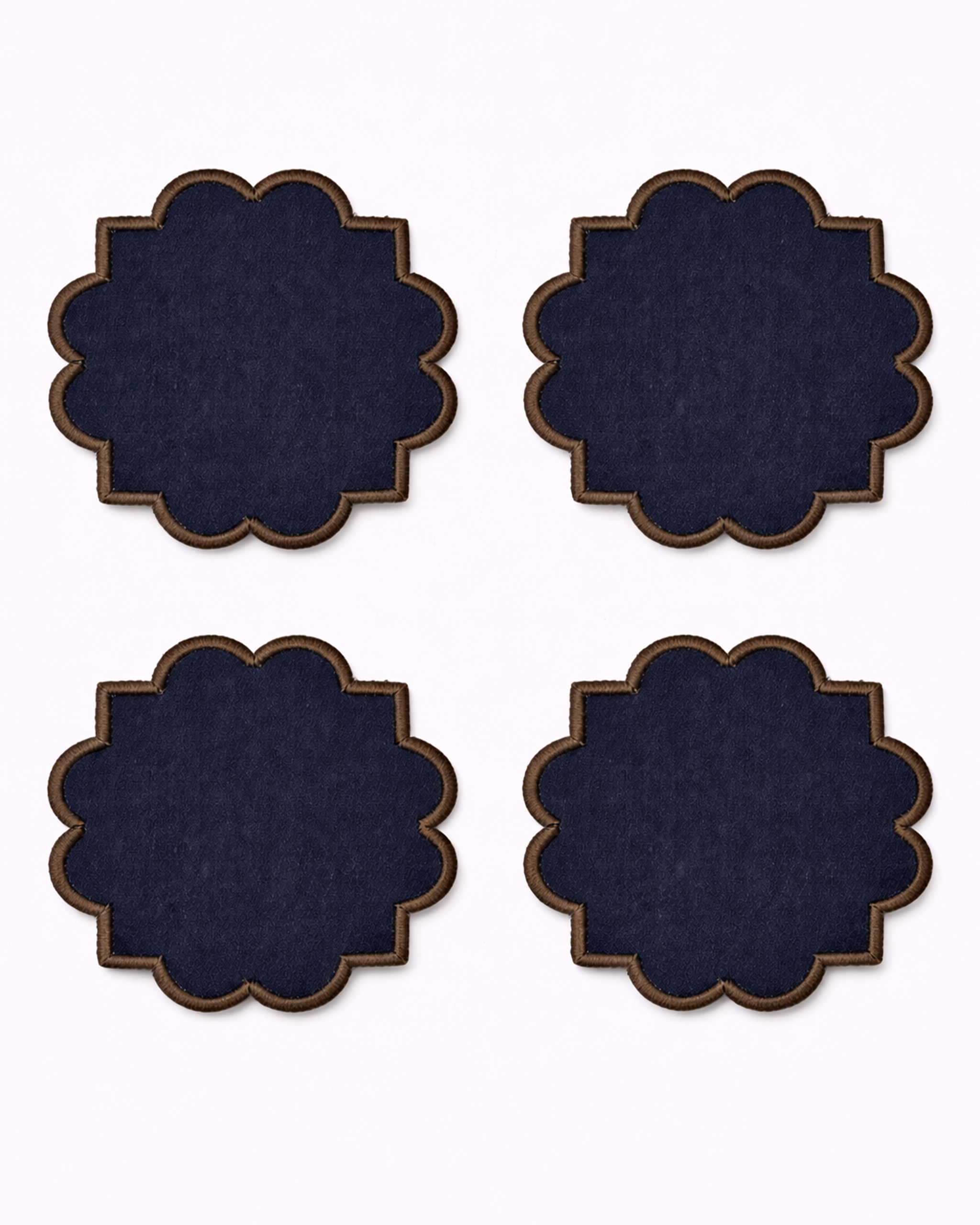 Four navy blue cotton coasters front view