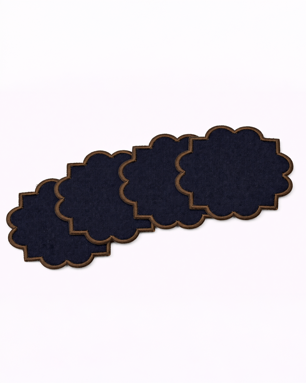 Set of four navy blue cotton coasters front view