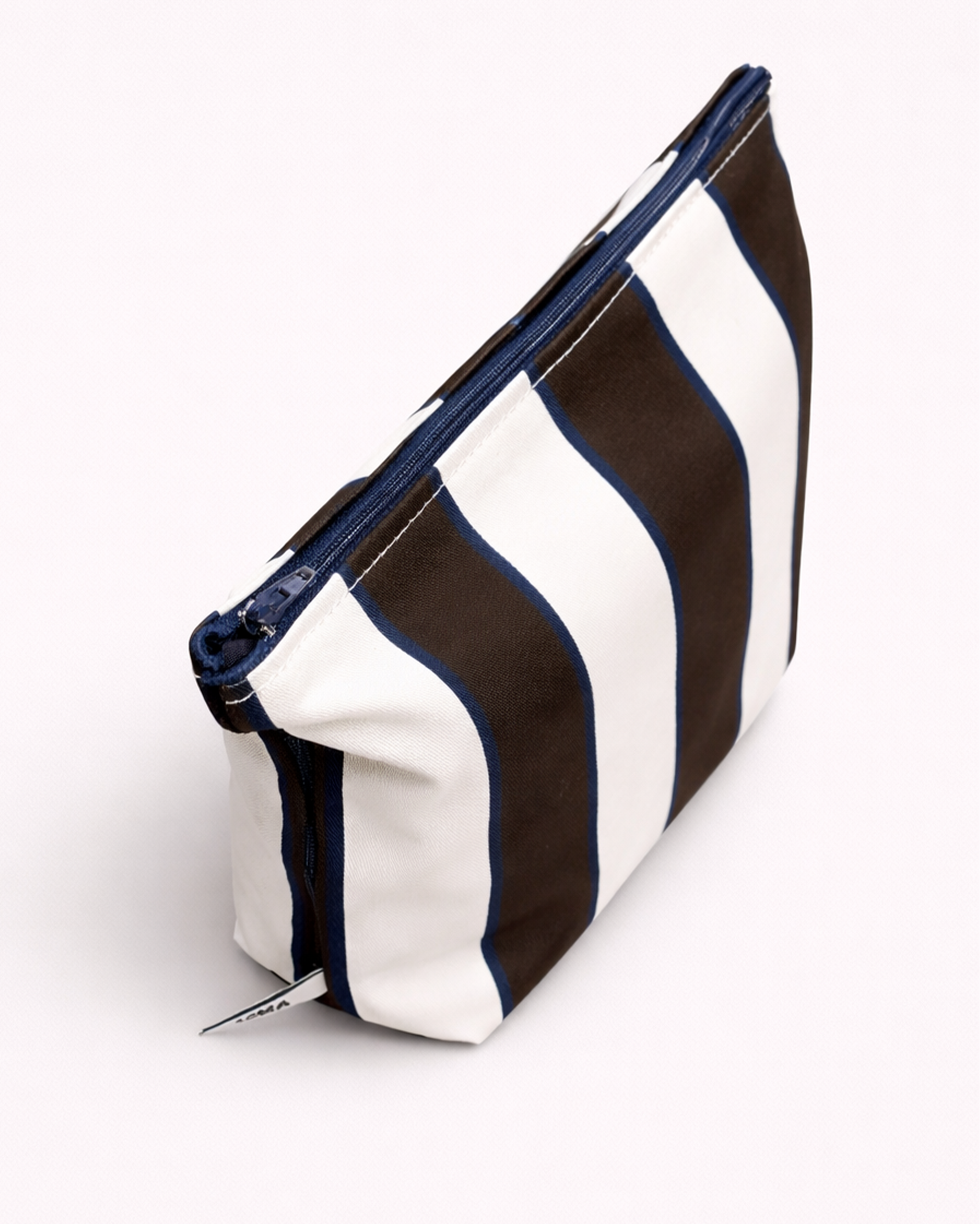 Striped toiletry bag with brown and white pattern and a blue zipper side view