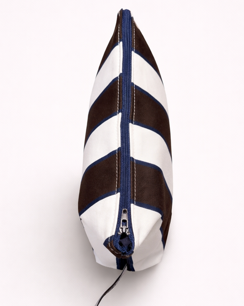 Striped cotton toiletry bag with brown and white stripes and a blue zipper top view